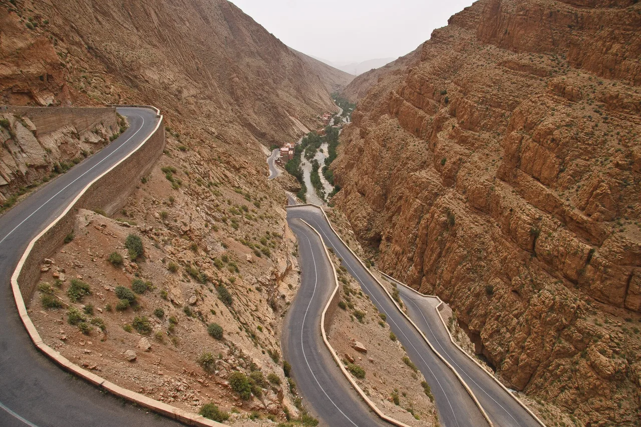 The hairpin bends of the road climbing the Dades gorge between red rock walls