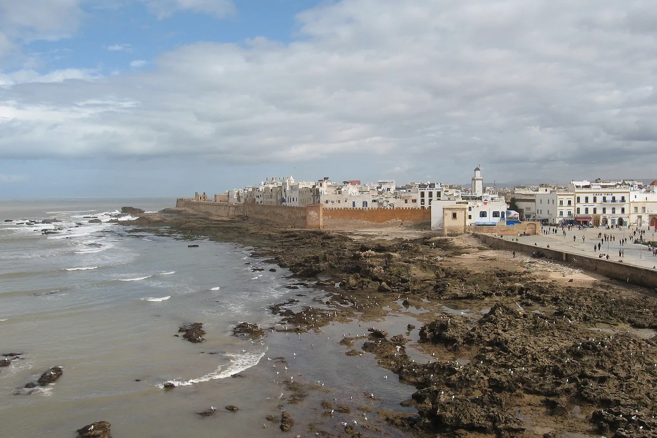 The ramparts of Essaouira under a grey sky with a choppy Atlantic, cool and windy