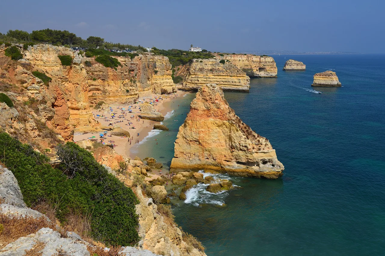 Praia da Marinha in the Algarve, its ochre cliffs and turquoise water seen from above
