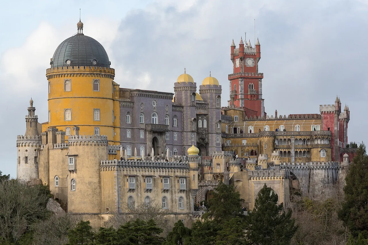 The Pena National Palace in Sintra, its yellow and red towers above the forest