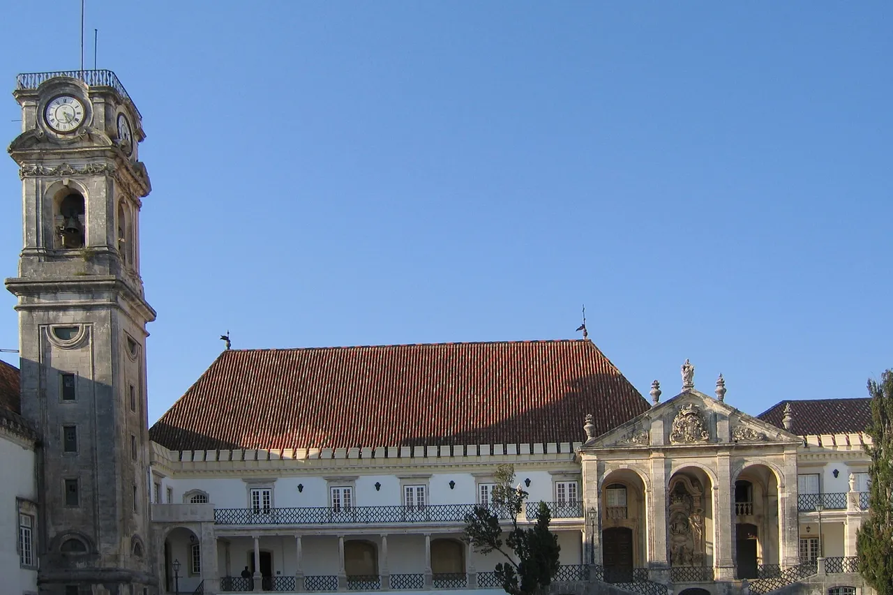 The tower of the University of Coimbra rising above the buildings of the Paço das Escolas