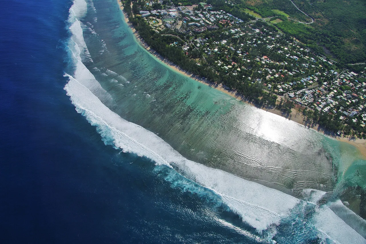 Aerial view of the Hermitage lagoon protected by the coral reef, west coast of Réunion Island