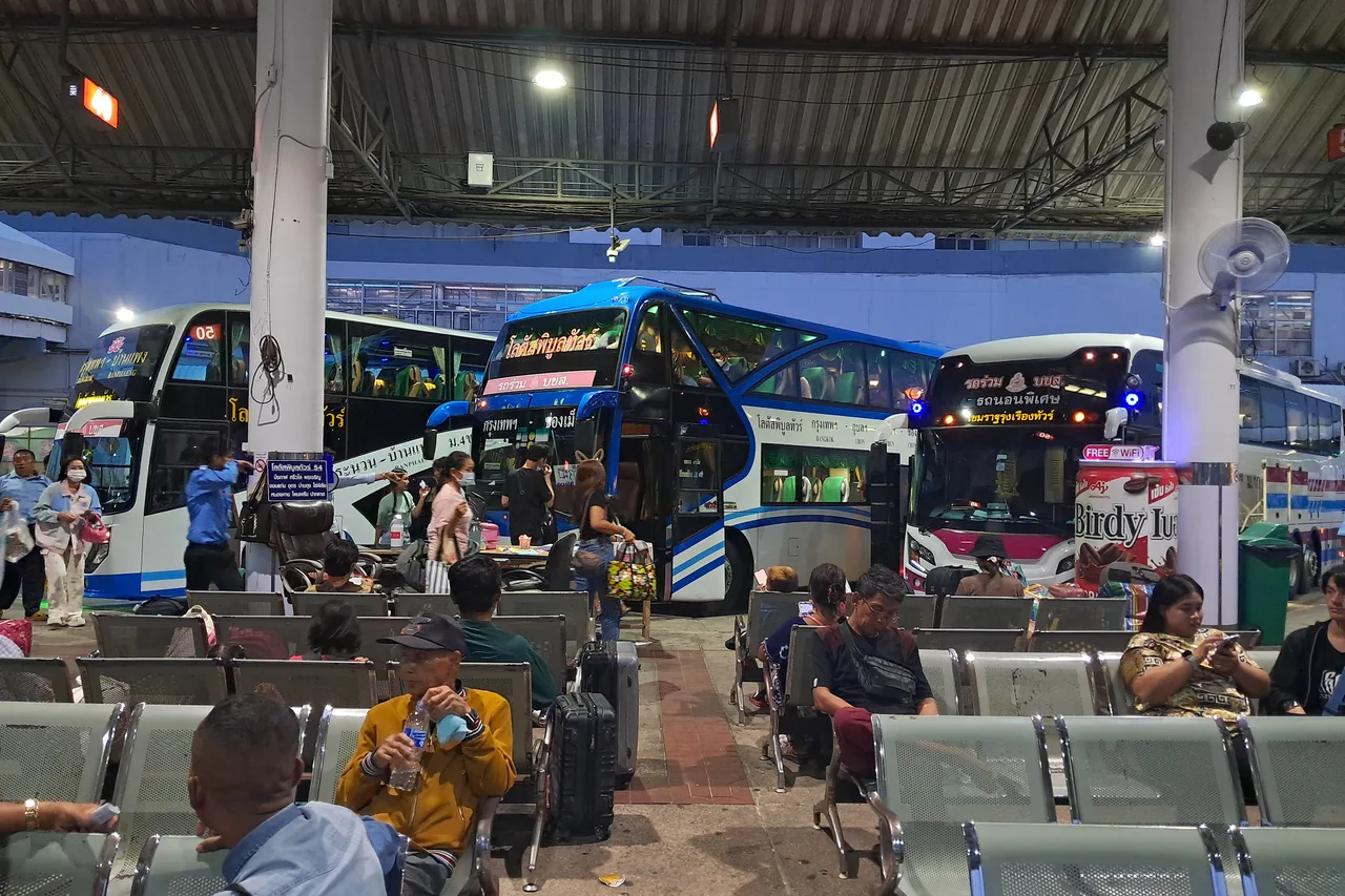 Long-distance coaches lined up along the departure platform at Mo Chit 2 terminal, Bangkok