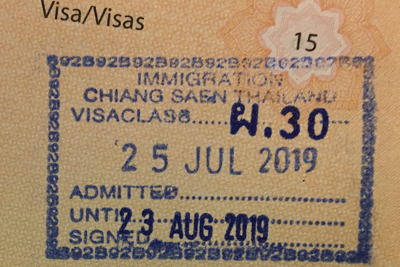 A Thai entry stamp in a passport showing the date until which the stay is authorised, Chiang Saen checkpoint, July 2019